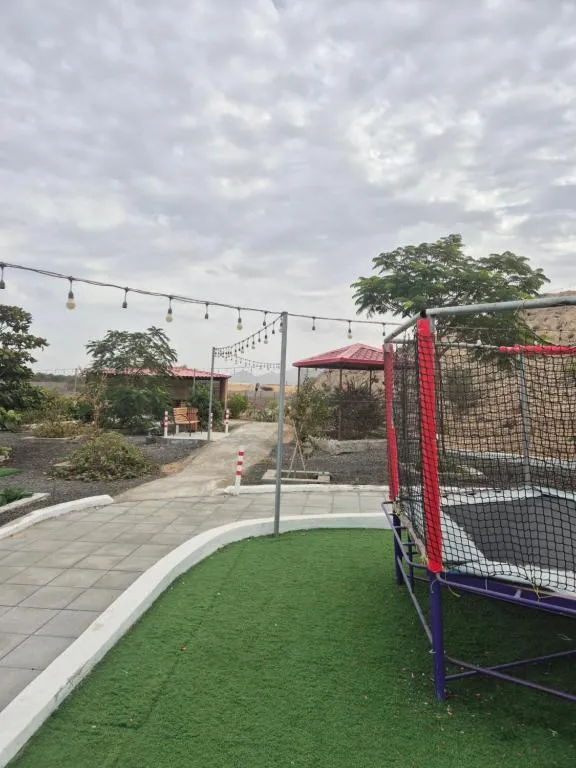 Trampoline area at Jory Hatta Resort surrounded by greenery.