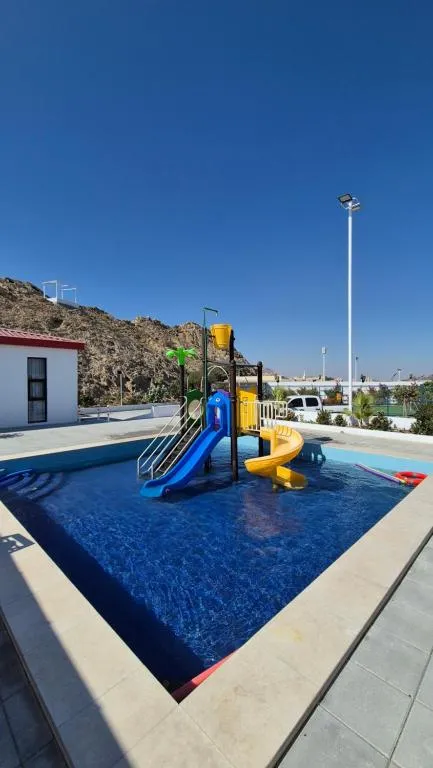 Kids' pool with water slides at Jory Hatta Resort.