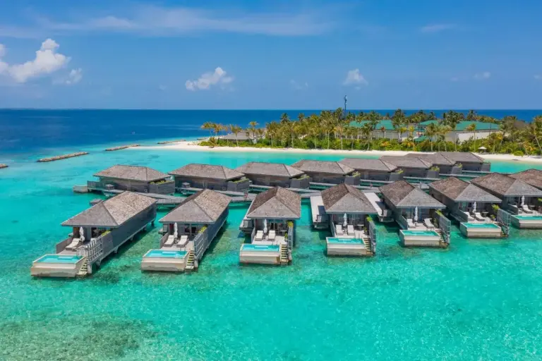 Aerial view of water villas at Kagi Maldives Resort & Spa