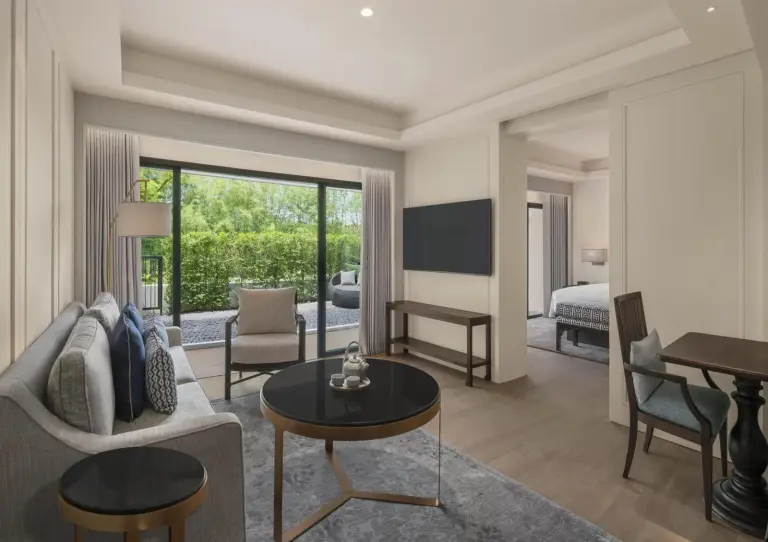 Living area in a suite at Kahavadi Chiang Rai, Curio Collection by Hilton