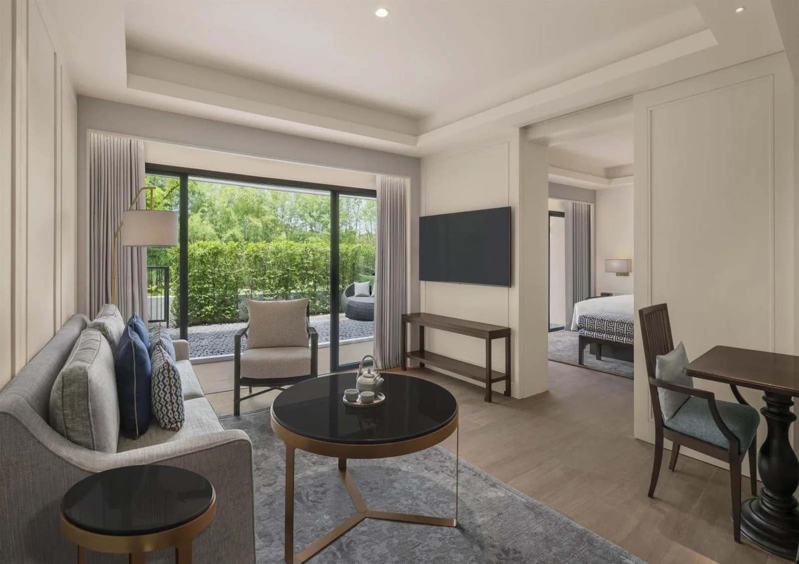 Living area in a suite at Kahavadi Chiang Rai, Curio Collection by Hilton