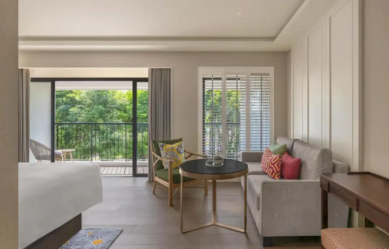 Sitting area in a Deluxe room at Kahavadi Chiang Rai, Curio Collection by Hilton