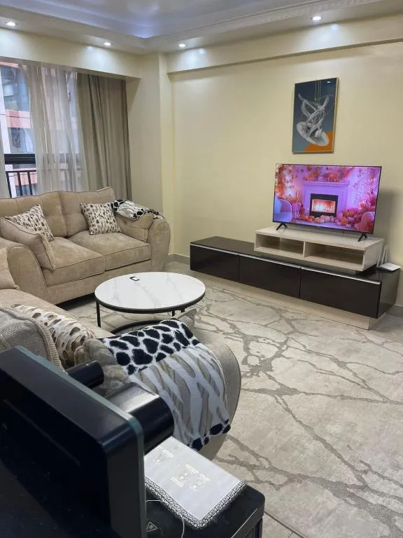 Cozy living room with TV at Kaisa Garden Nairobi