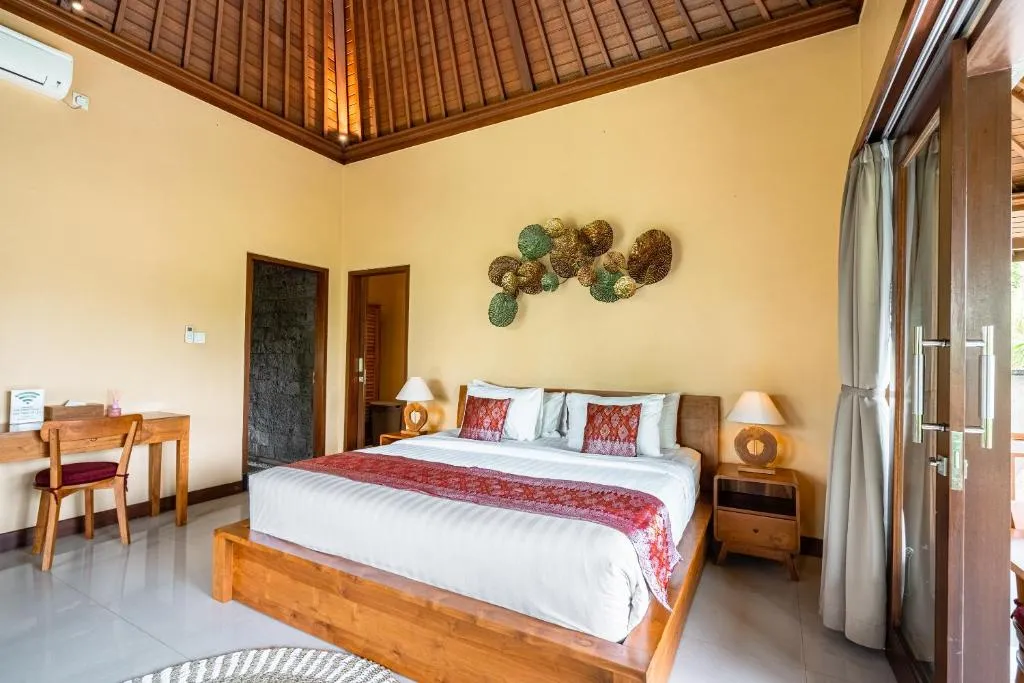 Chambre accueillante au Kak Oman By Madhava Villas avec un lit confortable