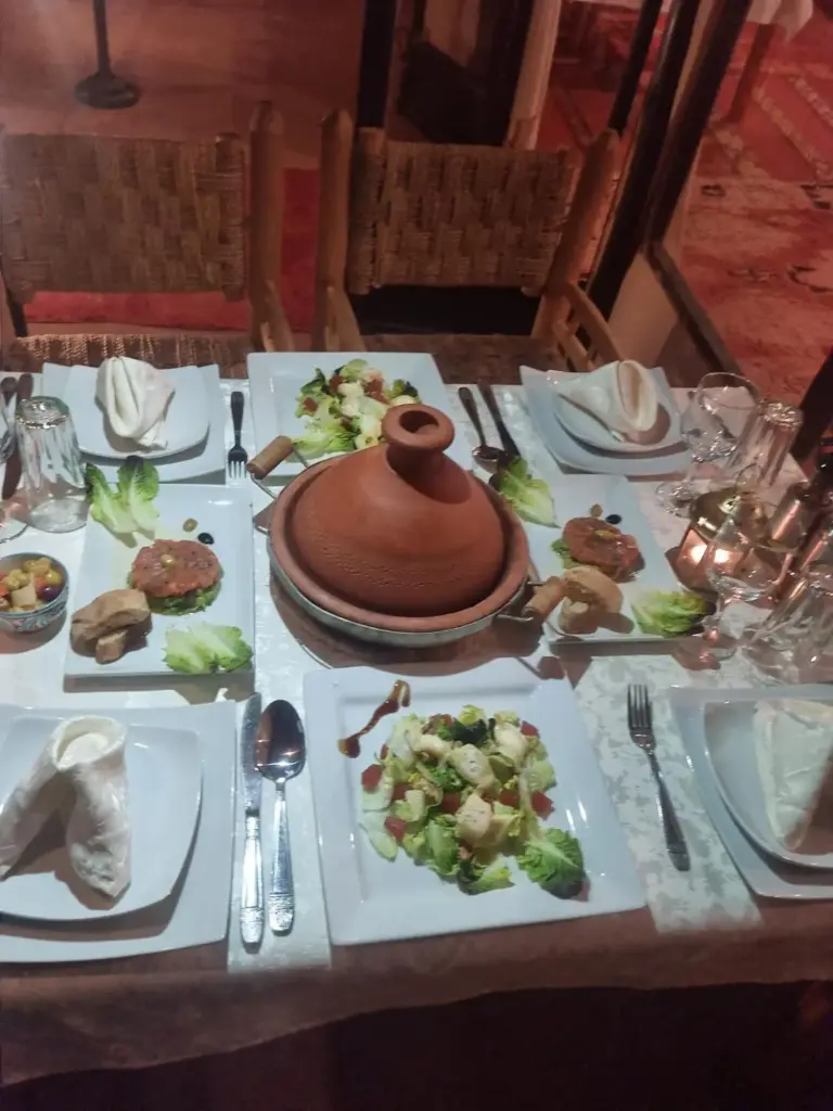 Kalimba Luxury Desert Camp dinner setup with Moroccan cuisine