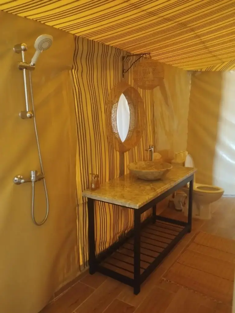 Kalimba Luxury Desert Camp modern bathroom with a unique sink design