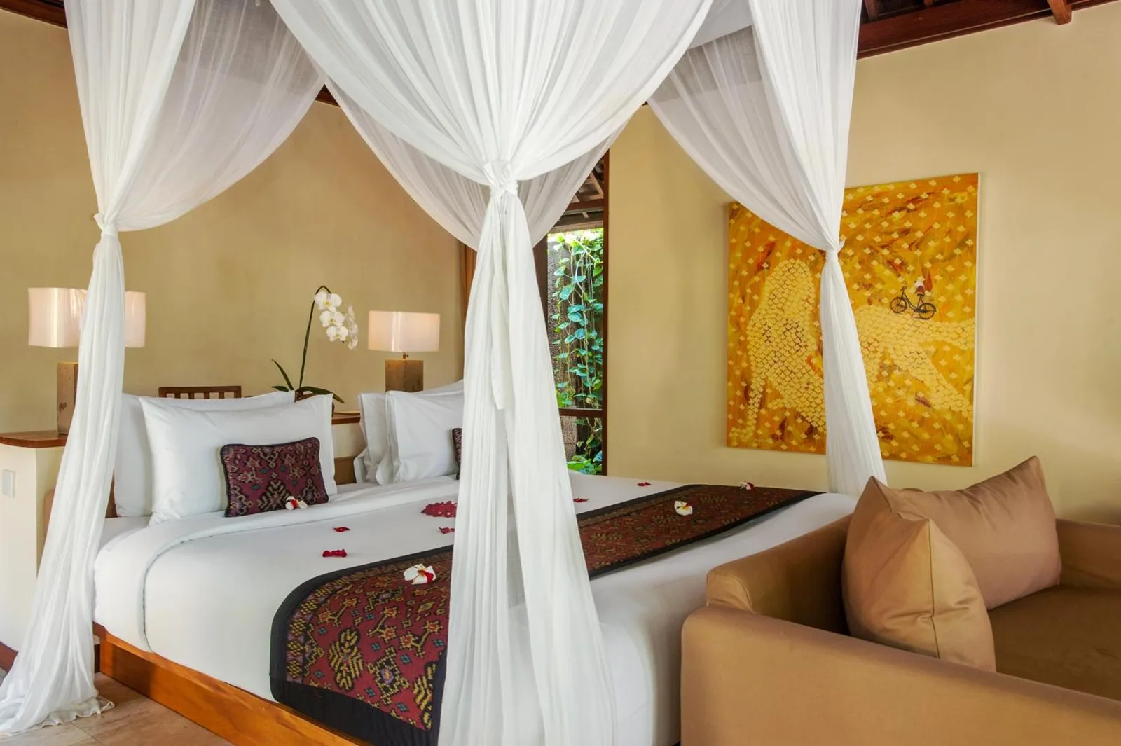 Stylish bedroom with decorative art at Komaneka at Tanggayuda Ubud
