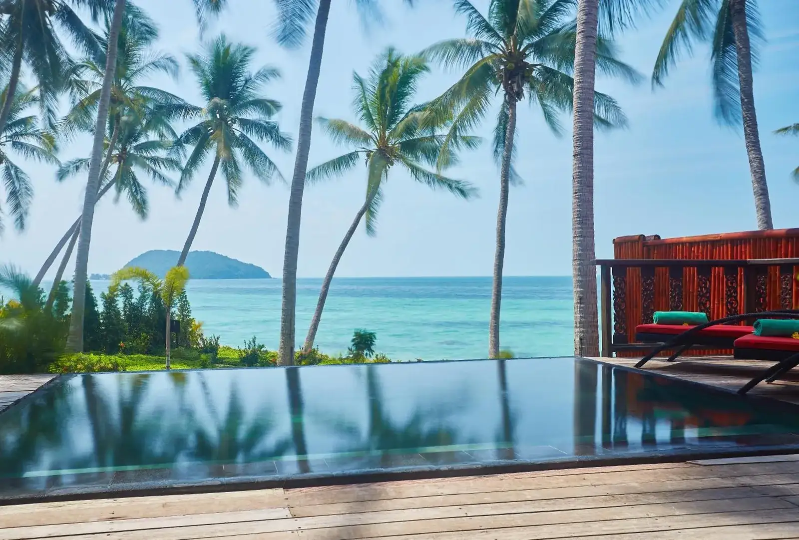 Serene beachside pool view at Kupu Kupu Phangan Beach Villas & Spa