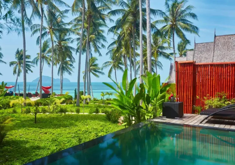 Lush gardens by the pool at Kupu Kupu Phangan Beach Villas & Spa