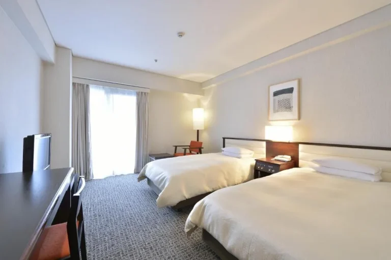 A bright double room at Kyoto Tokyu Hotel with two beds