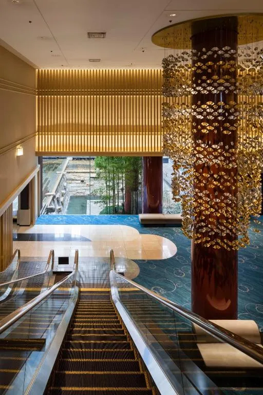 A view of the lobby at Kyoto Tokyu Hotel, showcasing a stylish staircase and decor