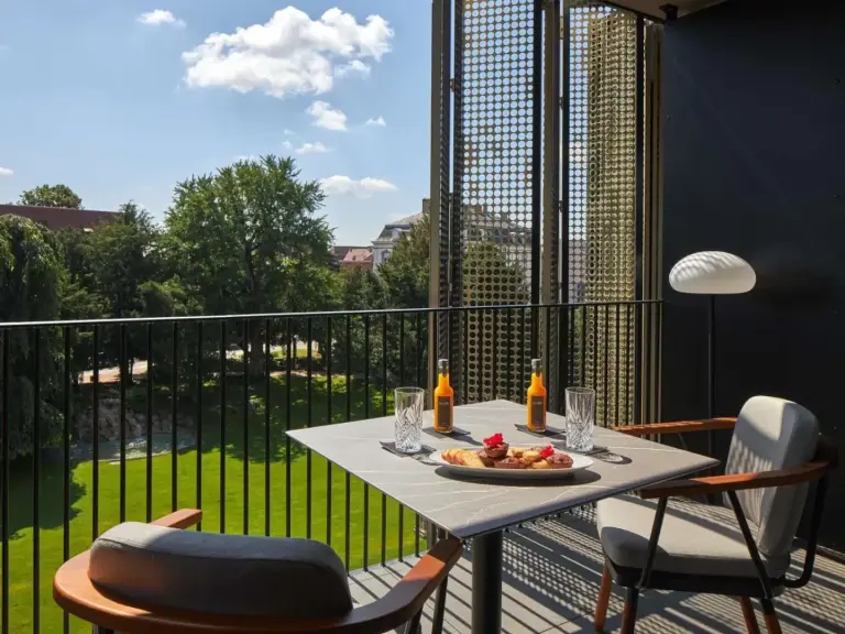 Balcony dining setup at L'Esquisse Hotel & Spa Colmar - MGallery Collection