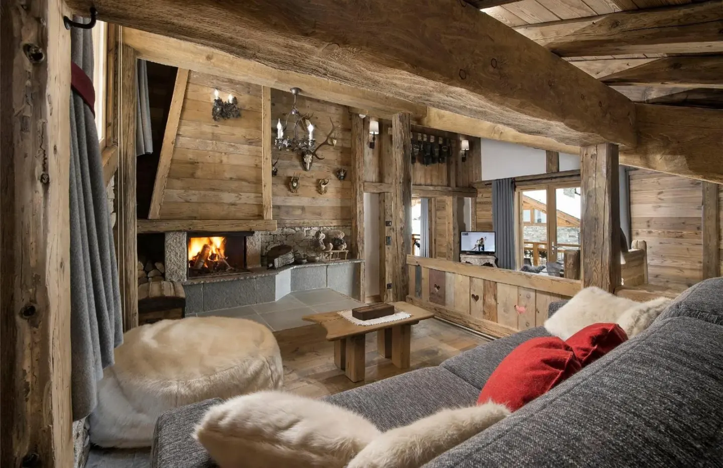 Acogedora zona de lounge en La Bouitte - Hôtel Relais & Châteaux en Courchevel