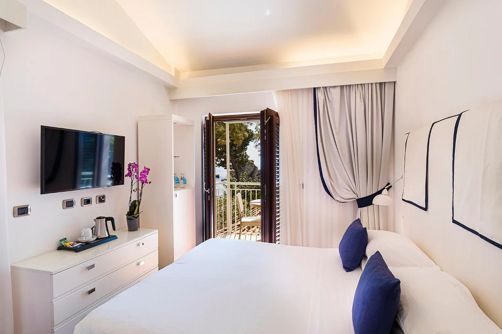 Cozy guest room at La Plage Resort, Taormina