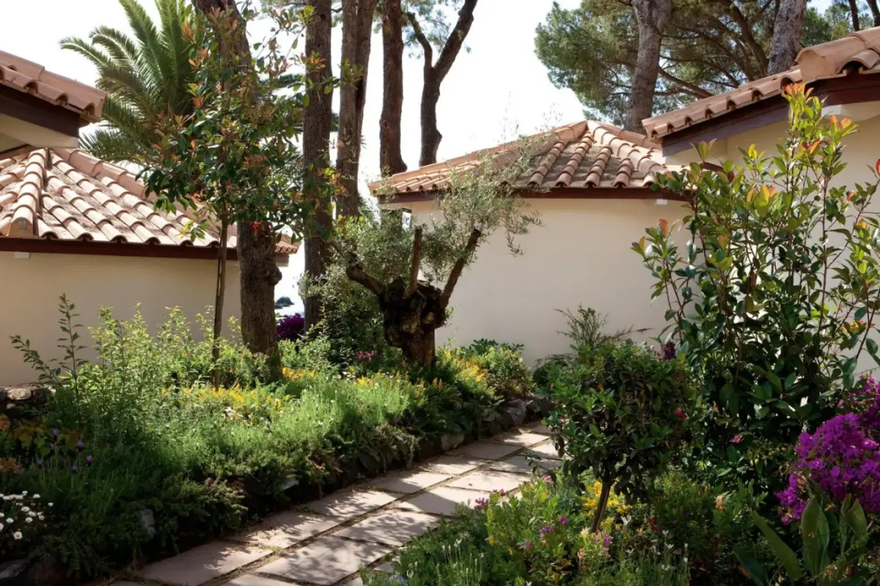 Lush garden path at La Plage Resort, Taormina