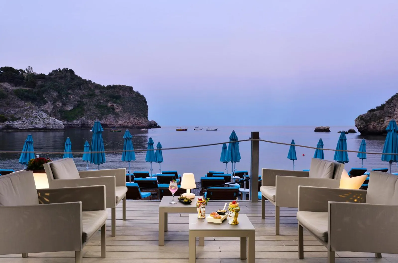 Seaside lounge area at La Plage Resort, Taormina