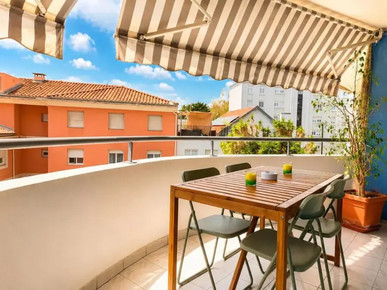 La Terrasse Bleue hotel balcony with outdoor dining set