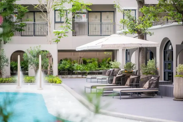 Pool deck with loungers at Lacasita484 In Huahin in Hua Hin