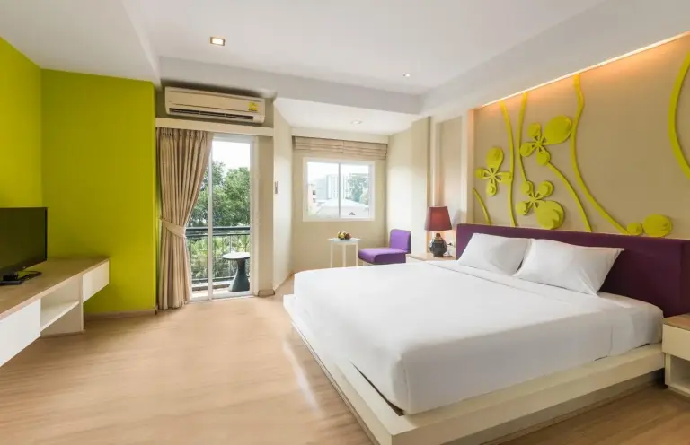 Spacious suite bedroom at Lantana Pattaya - SHA Extra Plus in Pattaya with balcony access