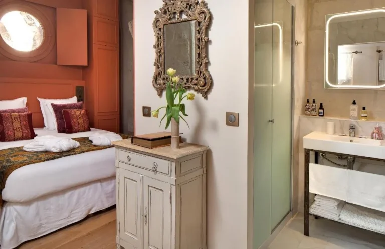 Bedroom and bathroom area in Le Cloitre des Augustins