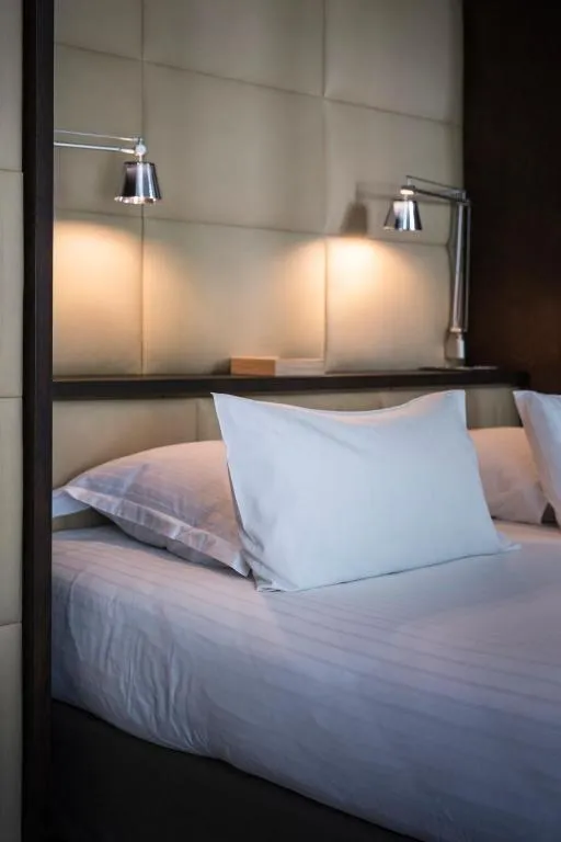 Close up of bed in a room at Le Hameau Albert 1er, Chamonix-Mont-Blanc