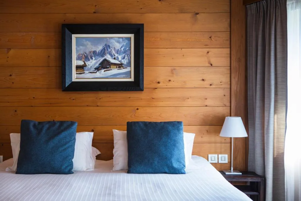 Detailed view of a charming bedroom at Le Hameau Albert 1er, Chamonix-Mont-Blanc