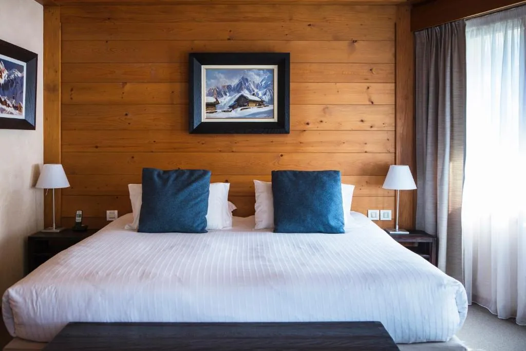 Charming wooden bedroom at Le Hameau Albert 1er in Chamonix-Mont-Blanc