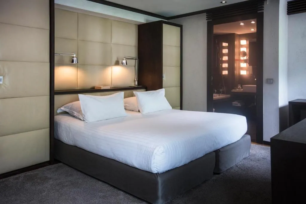 Cozy bedroom at Le Hameau Albert 1er in Chamonix-Mont-Blanc with modern amenities