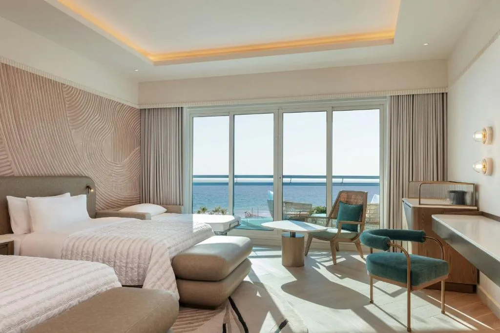 Twin room with sea view at Le Meridien Al Aqah Beach Resort