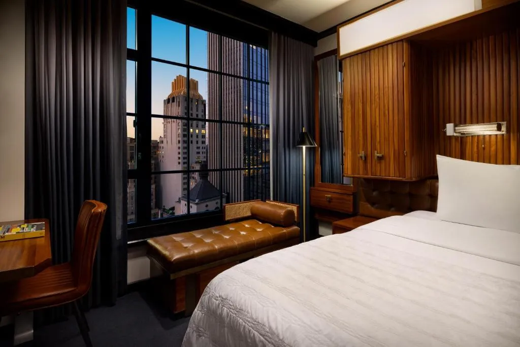 Elegant bedroom with city view at Le Meridien New York, Central Park