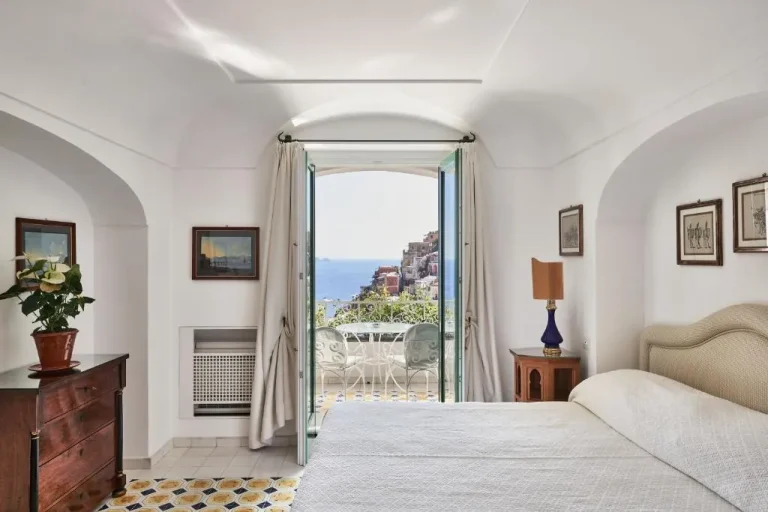 Cozy bedroom at Le Sirenuse in Positano with terrace