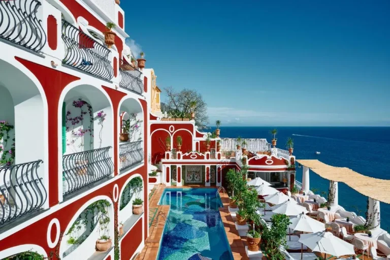 The pool area of Le Sirenuse in Positano with ocean view