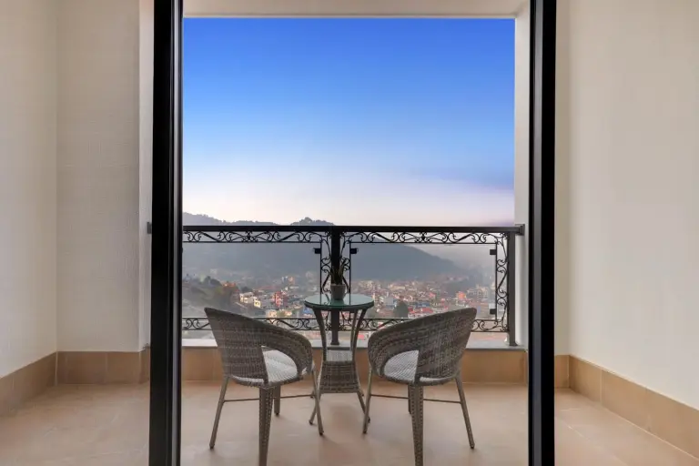 Balcony seating with panoramic Kathmandu views at Lemon Tree Premier Budhanilkantha Kathmandu, Nepal