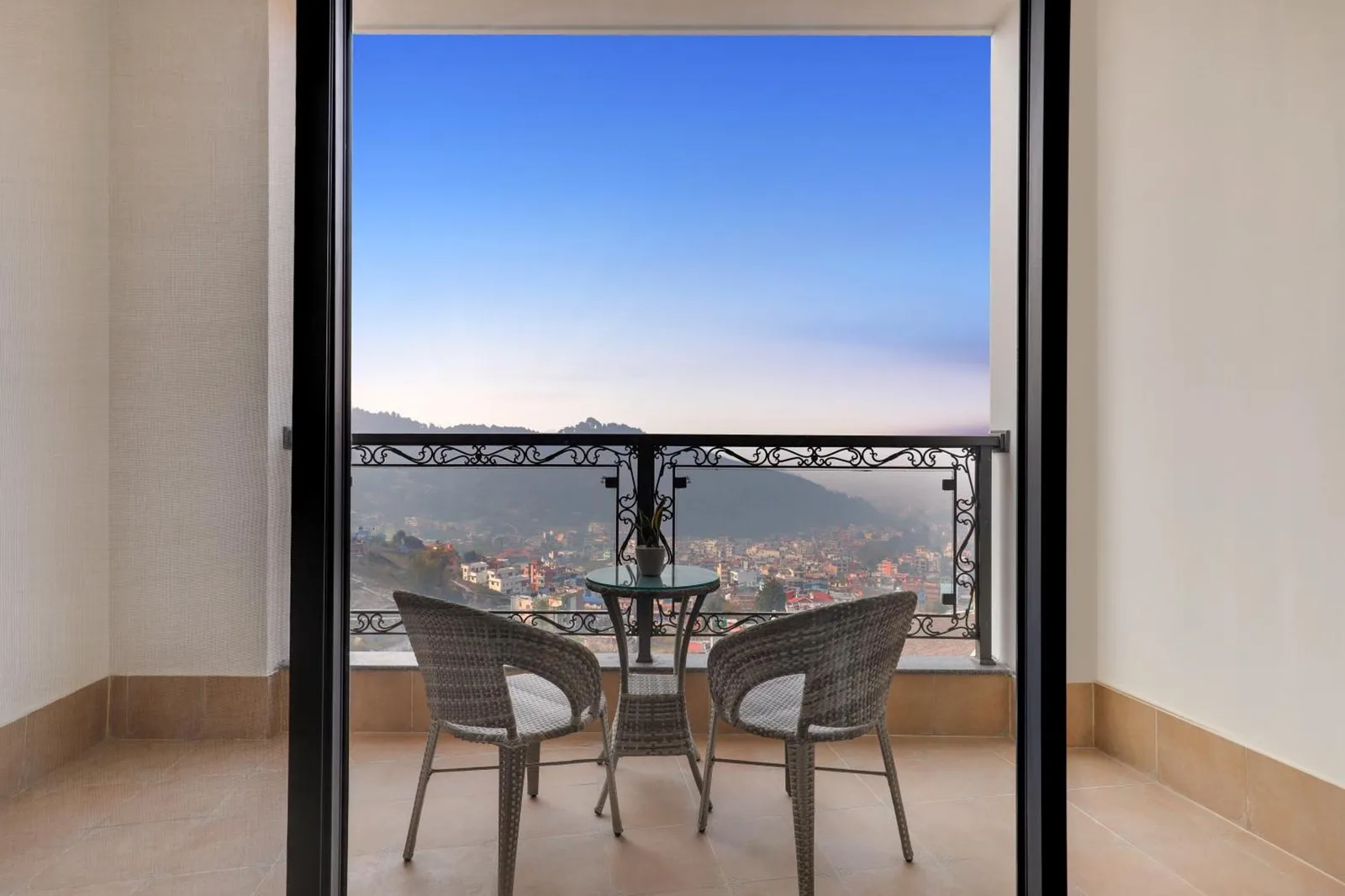 Balcony seating with panoramic Kathmandu views at Lemon Tree Premier Budhanilkantha Kathmandu, Nepal