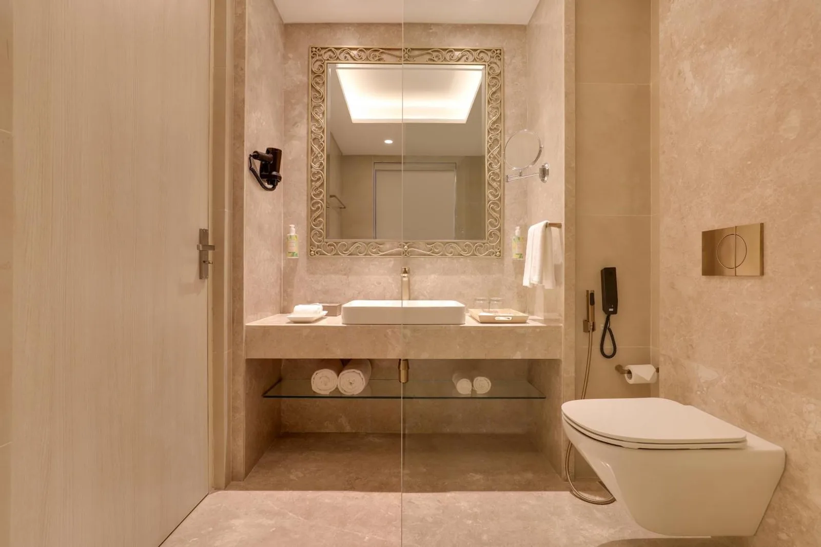 Bathroom vanity area at Lemon Tree Premier Budhanilkantha Kathmandu, Nepal with mirror, sink, and shower