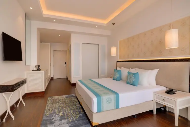 King room interior at Lemon Tree Premier Budhanilkantha Kathmandu, Nepal with warm lighting and contemporary design