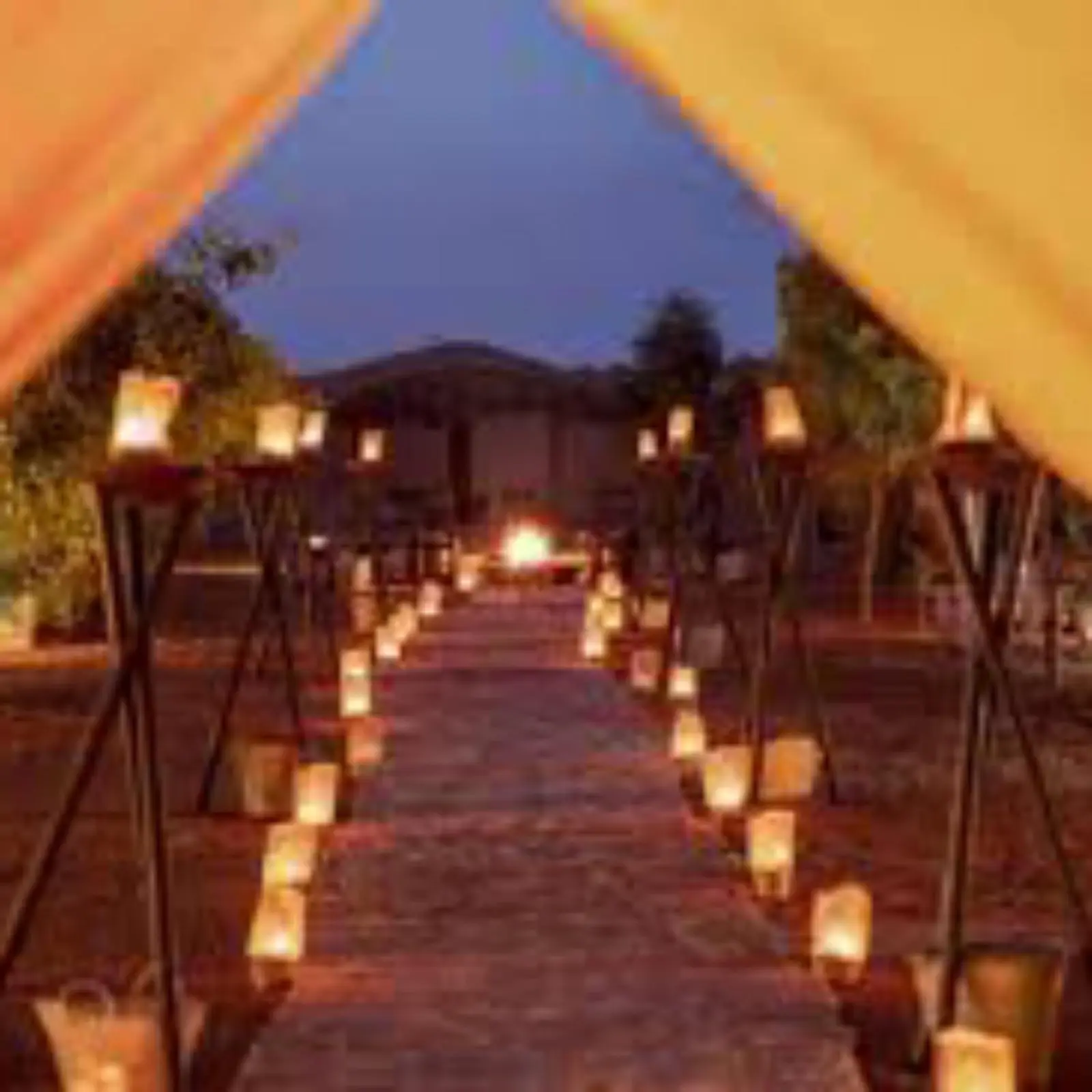 Pathway lined with candles at Les Pyramides Luxury Desert Camp in Merzouga