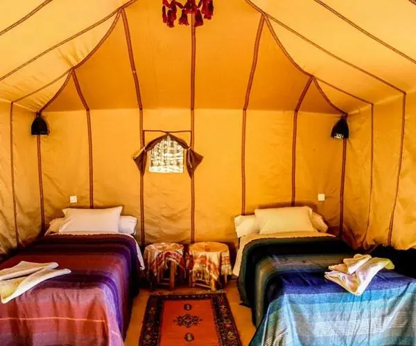 Interior of a tent at Les Pyramides Luxury Desert Camp in Merzouga