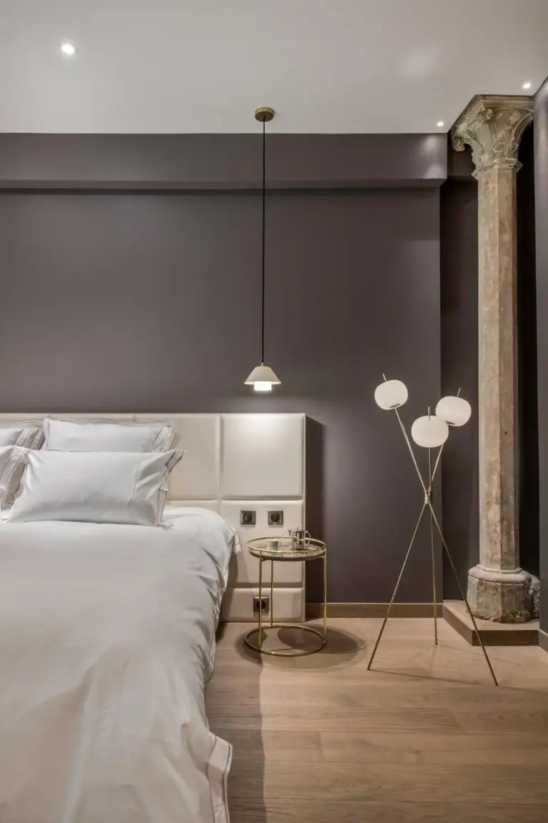Cozy bedroom corner in Les Suites de l'Ile Barbe hotel, Lyon