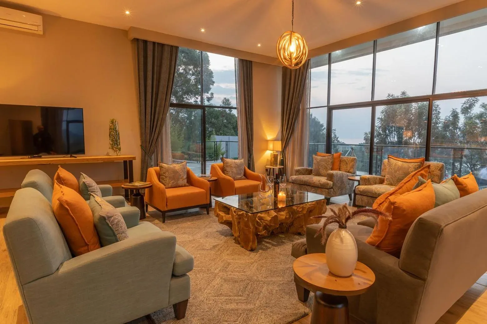 Stylish lounge area in LUX* Lake Kivu with ample seating and lake views.