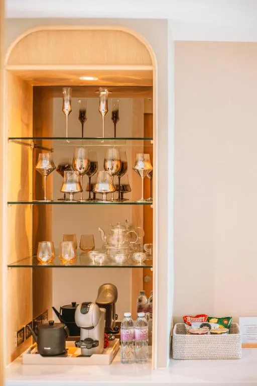 Luxtalay Khanom Hotel mini bar with glasses and kettle