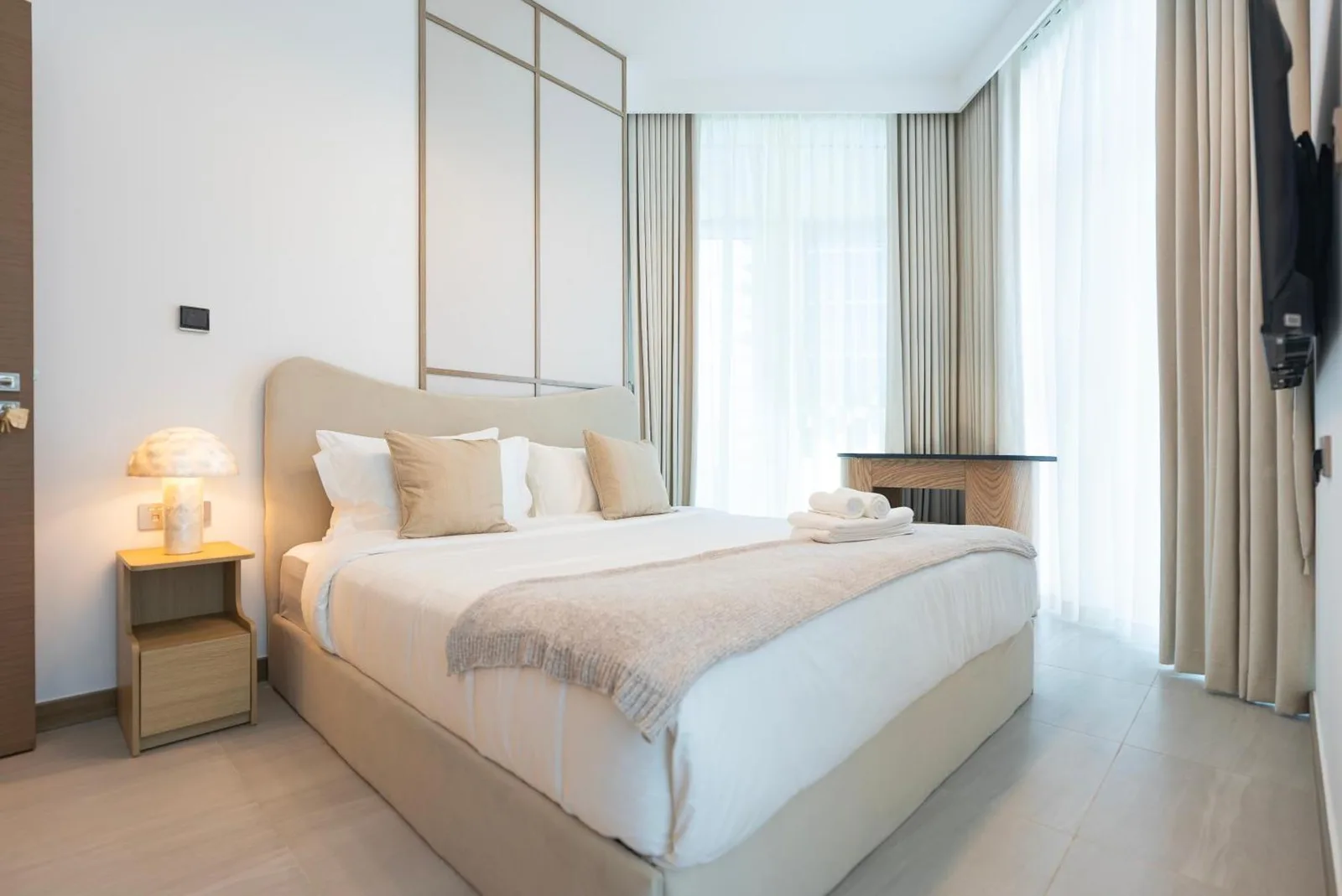 Luxury 1 & 2 BHK Apartments cozy bedroom area in Dubai