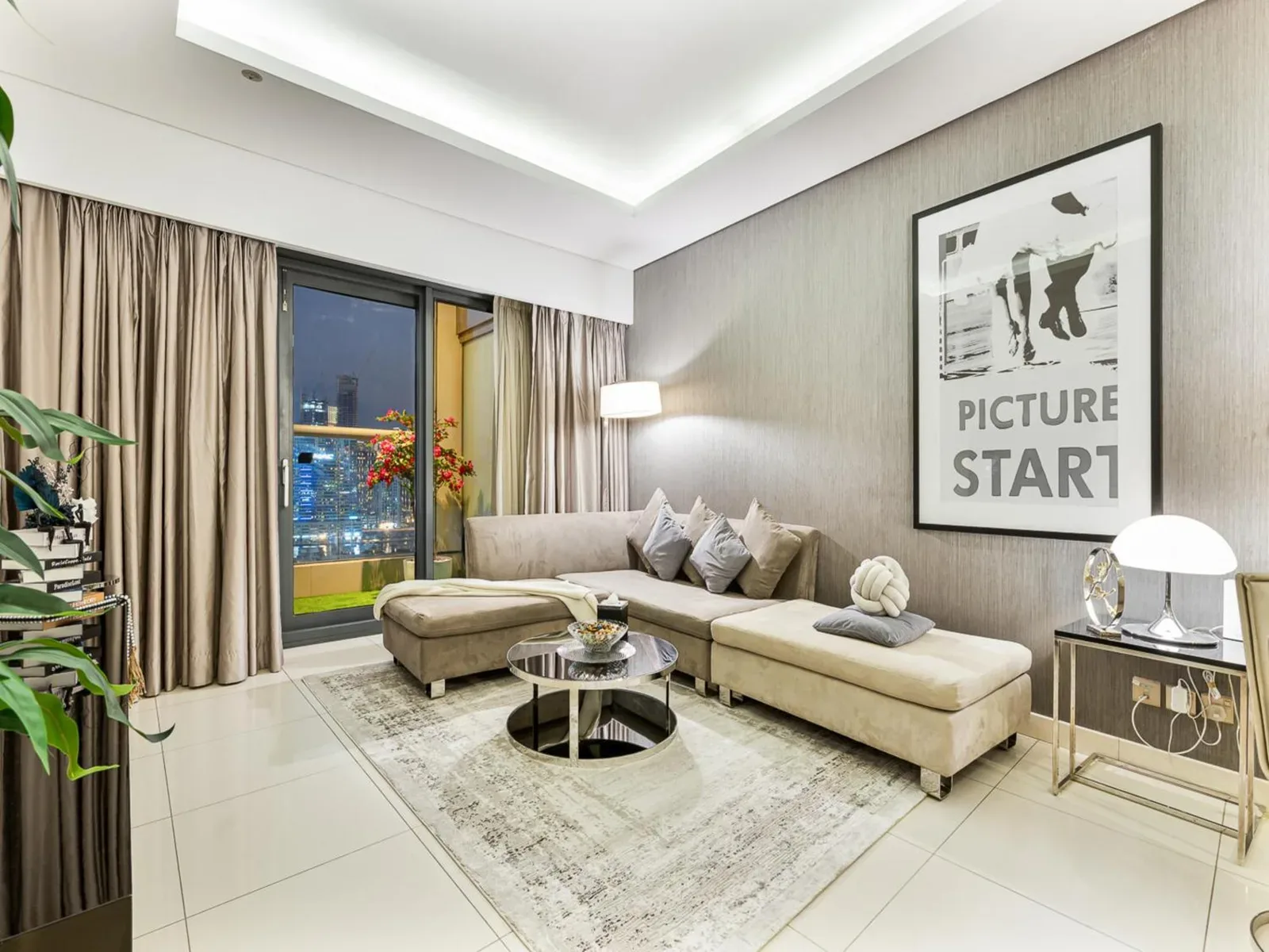 Luxury 1BR living room with modern decor in Dubai.