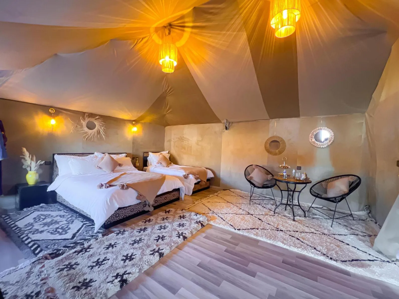Luxury berber style in Merzouga family suite with two beds and lounge table