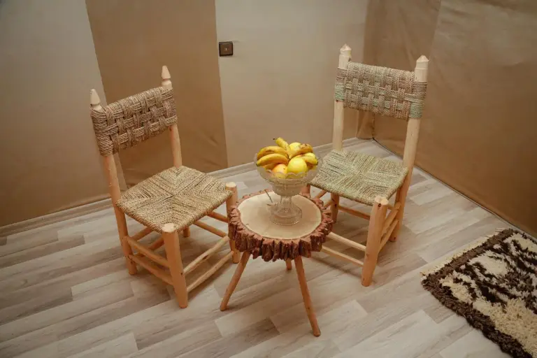 Luxury berber style in Merzouga seating area with woven chairs and a fruit table