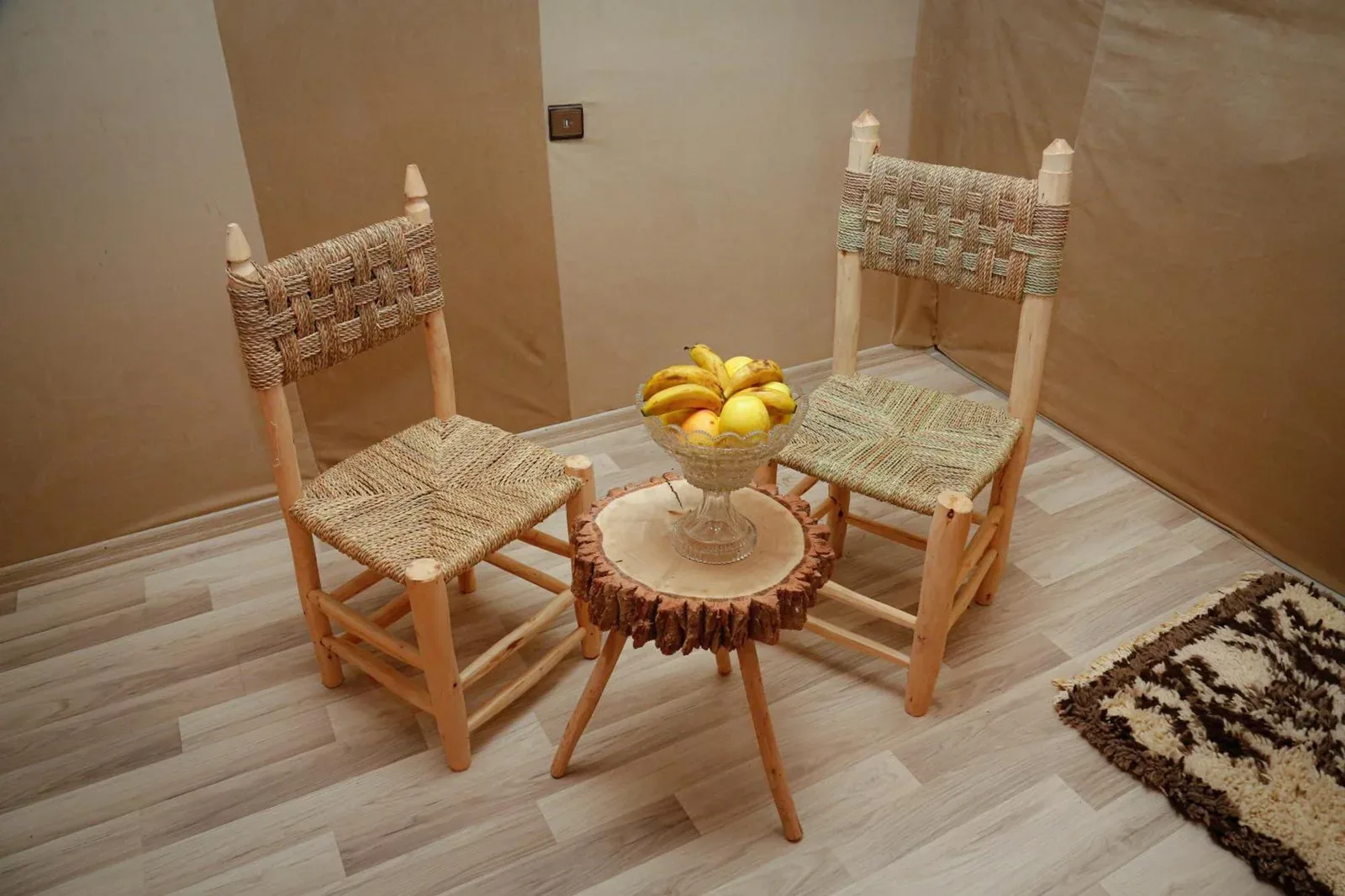 Luxury berber style in Merzouga seating area with woven chairs and a fruit table