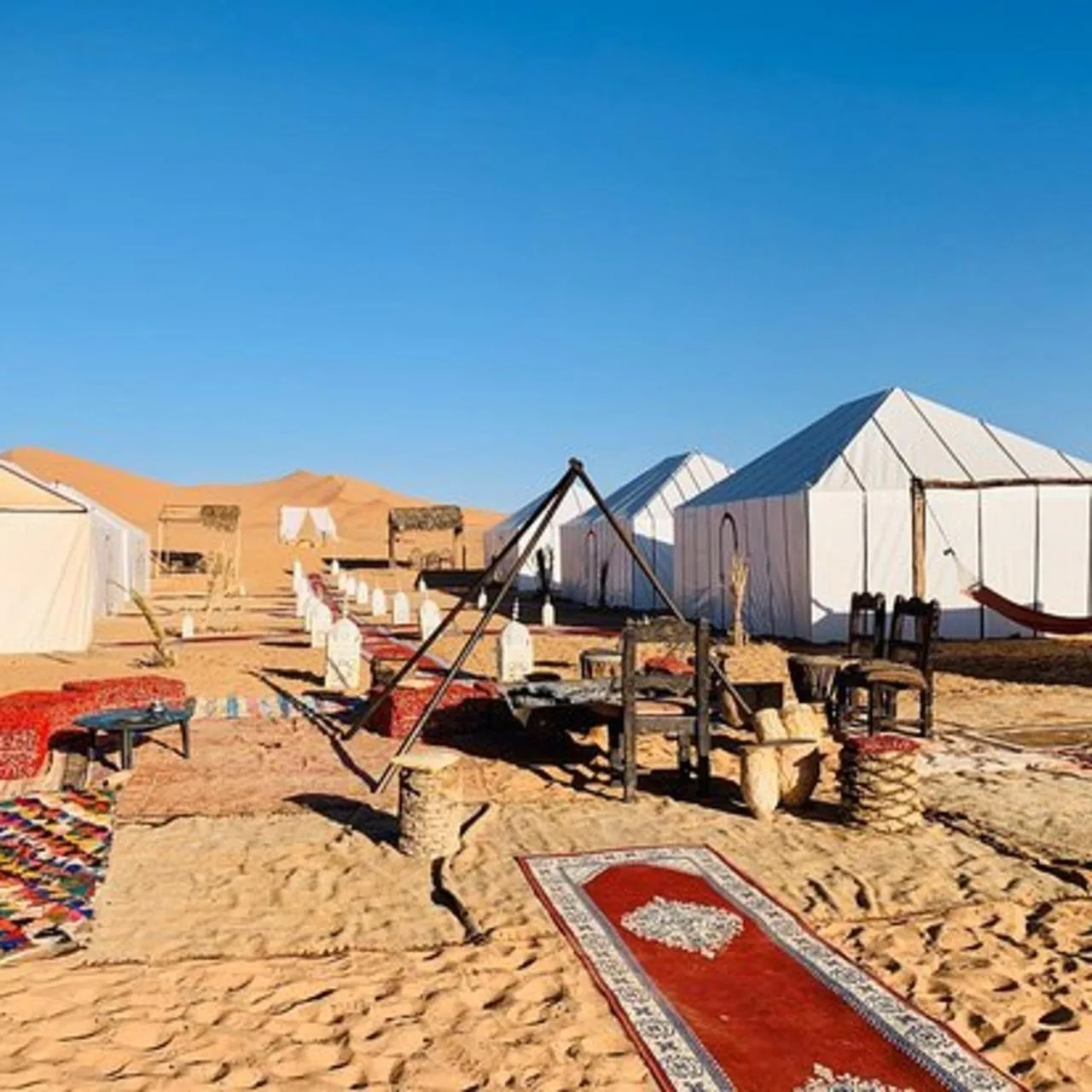 Exterior view of the desert camp at Luxury Camp View in Merzouga with tents and outdoor seating