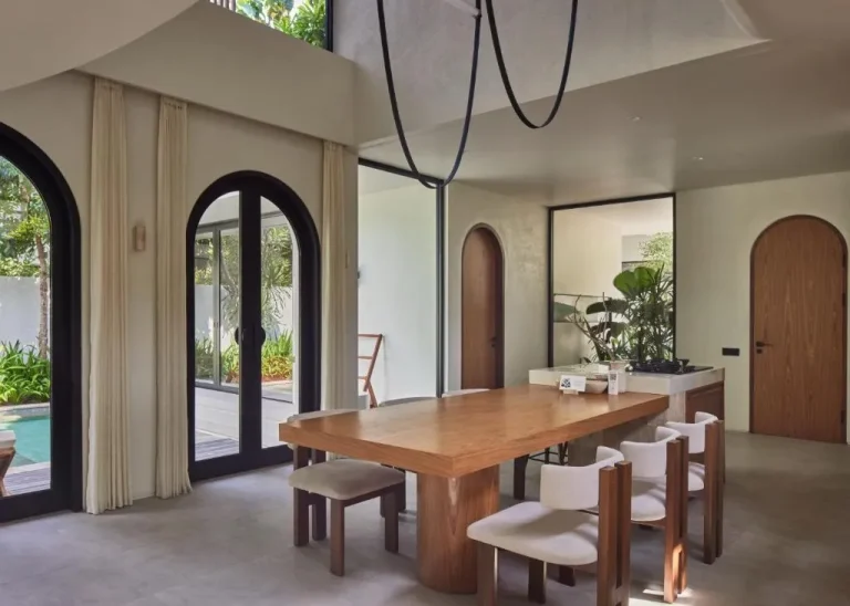Lyvin Bingin Villas dining area with a wooden table