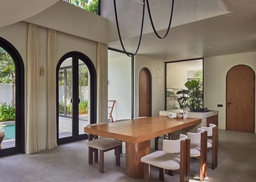 Lyvin Bingin Villas dining area with a wooden table