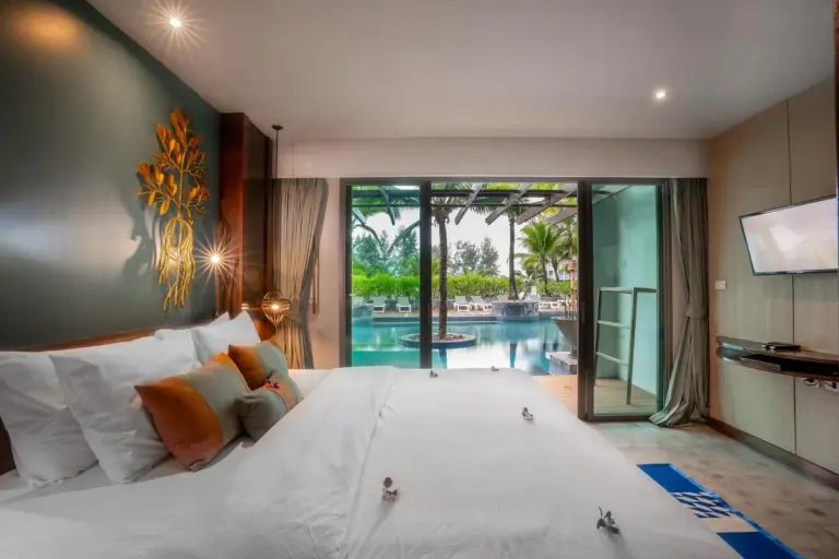 Mai Khaolak Beach Resort & Spa - TUIBLUE Mai Khaolak – Khao Lak, Thailand hotel – a dining room with a long table and chairs at Mai Khaolak Beach Resort & Spa - TUIBLUE Mai Khaolak in Khao Lak